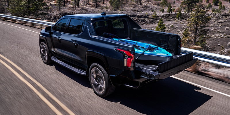 A 2019 Chevrolet Silverado driving along a scenic road.